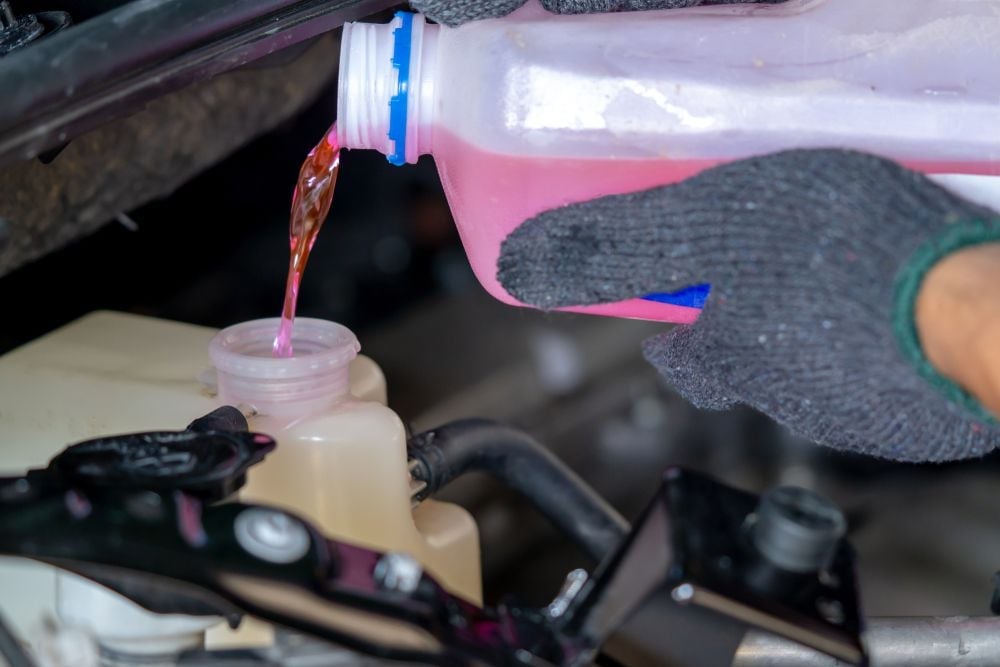 adding_coolant_to_a_coolant_reservoir_shutterstock_1341771407