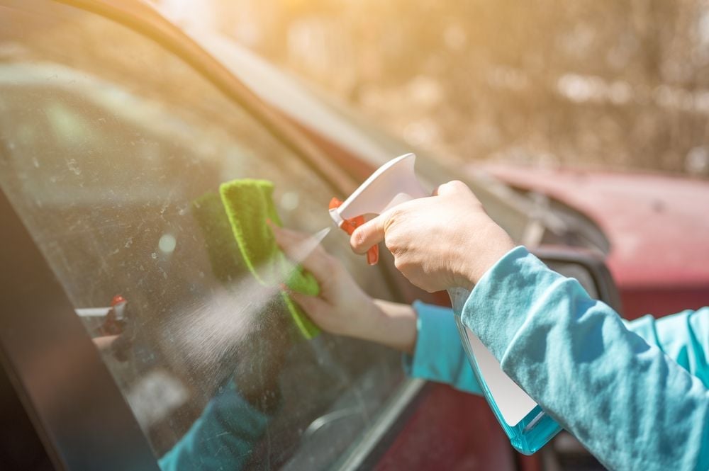 cleaning_car_window_with_windex_shutterstock_1960320721