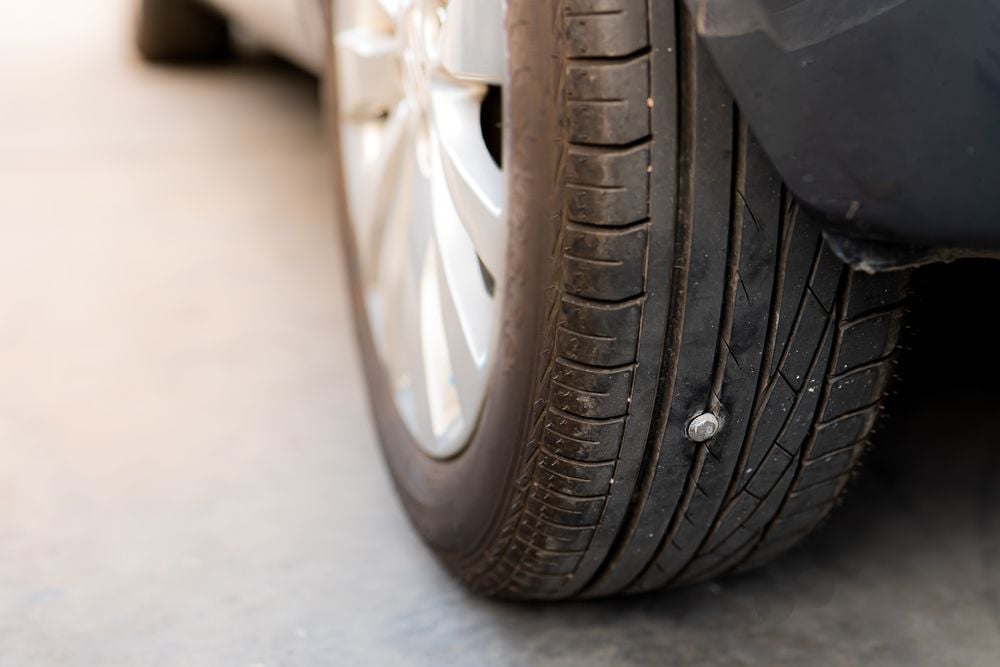 punctured_tires_can_be_fixed_with_fix_a_flat_shutterstock_2101718137