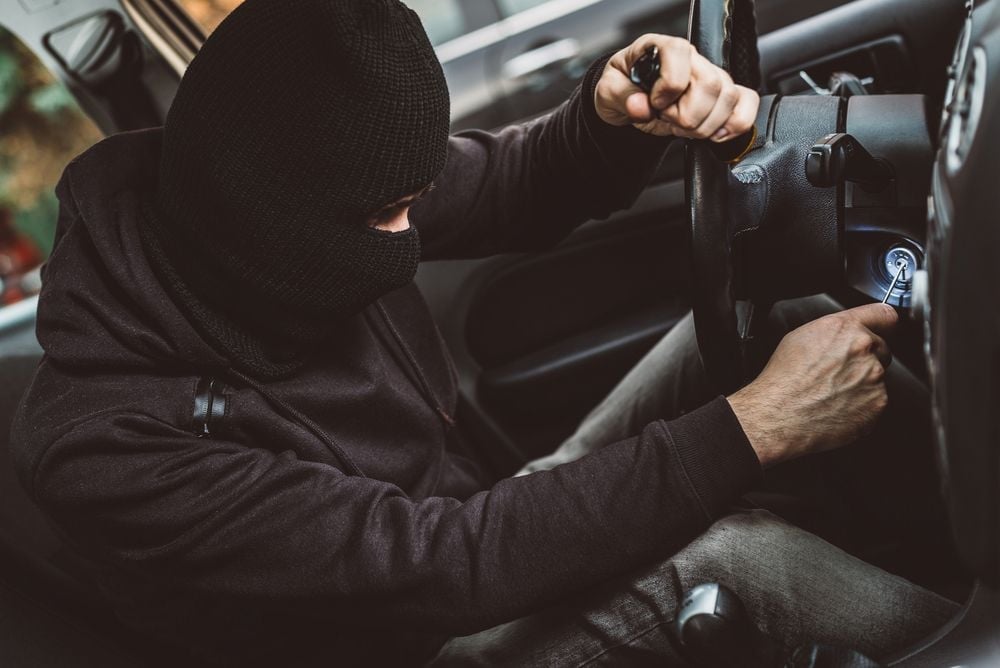 thief_attempting_to_steal_a_car_shutterstock_571866226