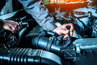 Mechanic replacing MAP sensor