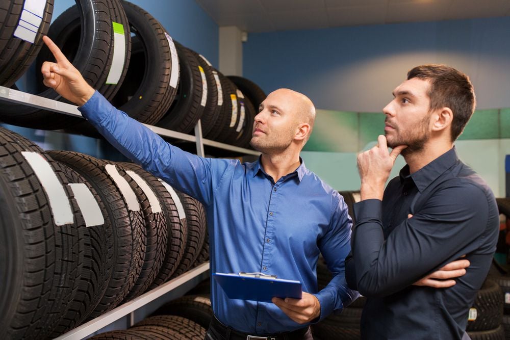 Customer looking at the manufacturing dates of the tires.