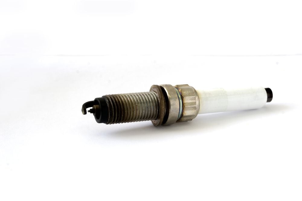 Fouled spark plugs could cause backfires.