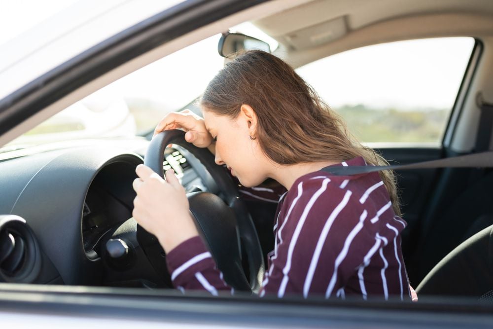 frustrated_because_car_won't_start_shutterstock_1866530749