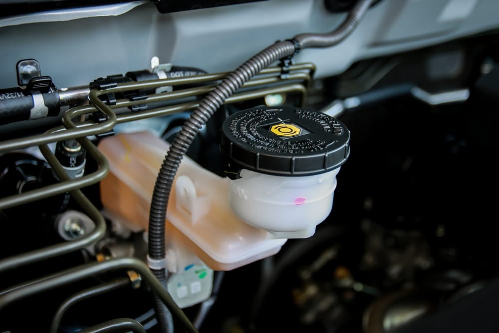 The power steering reservoir is located in the engine bay.